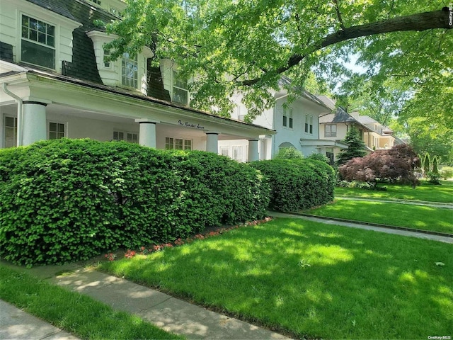 view of home's exterior featuring a lawn