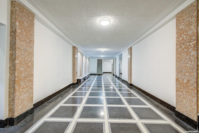 hallway featuring a textured ceiling