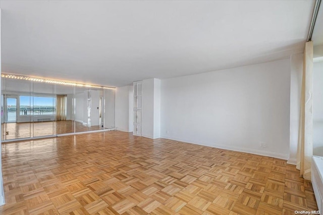 spare room featuring light parquet floors