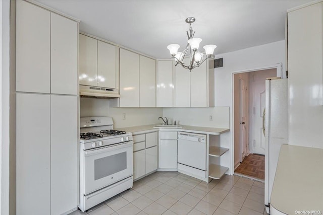 kitchen featuring white appliances, an inviting chandelier, sink, decorative light fixtures, and white cabinetry