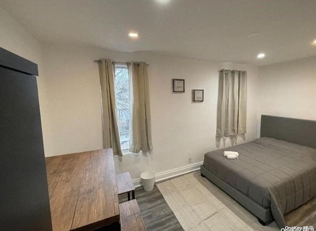 bedroom featuring hardwood / wood-style flooring