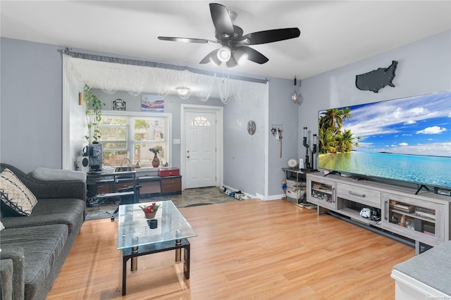 living room with ceiling fan and wood-type flooring