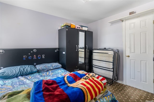 bedroom with dark colored carpet