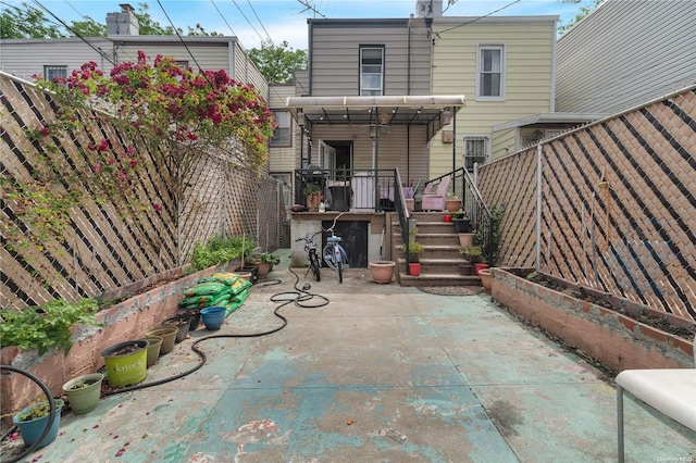 rear view of property featuring a patio area