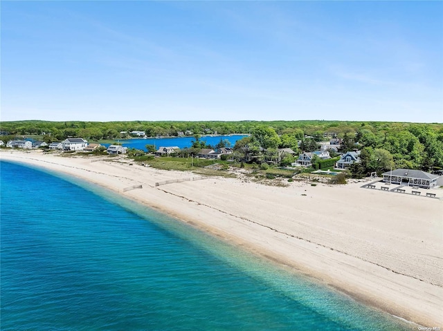 bird's eye view with a water view and a beach view