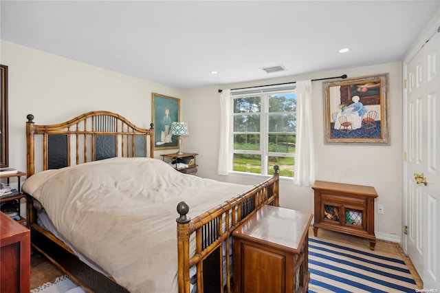 bedroom with hardwood / wood-style floors