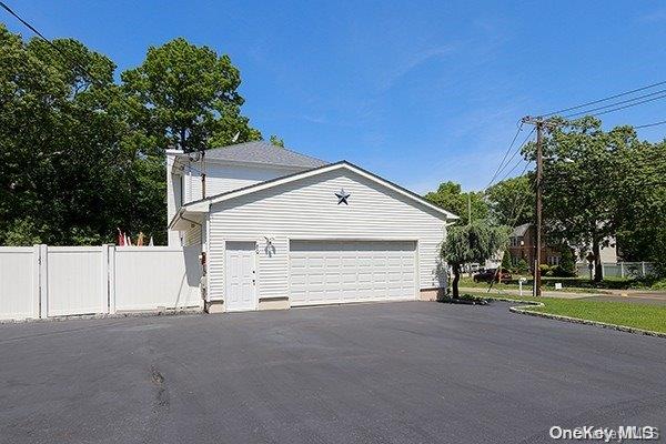 view of side of home with a garage