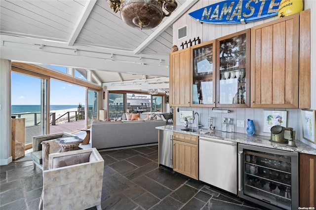 kitchen with dishwasher, lofted ceiling with beams, a water view, sink, and wine cooler