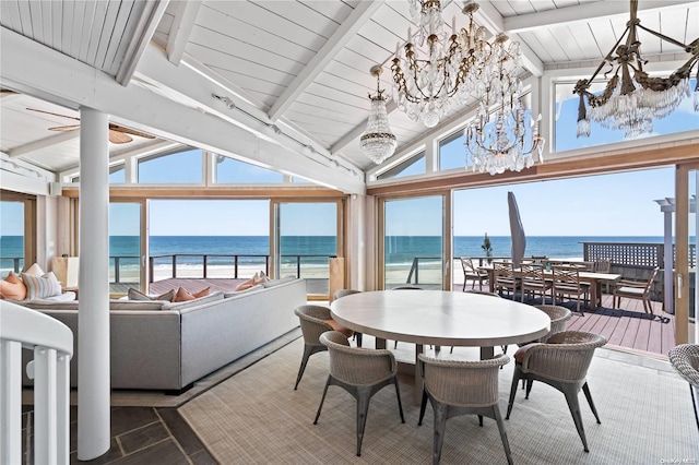 sunroom / solarium featuring wooden ceiling, lofted ceiling with beams, a water view, a beach view, and a chandelier