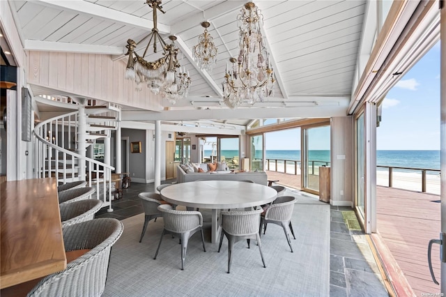 sunroom / solarium featuring wooden ceiling, vaulted ceiling with beams, a notable chandelier, a view of the beach, and a water view