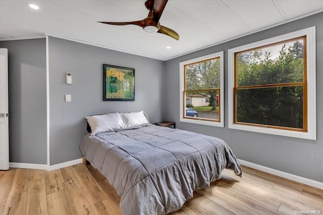 bedroom featuring ceiling fan and light wood-type flooring