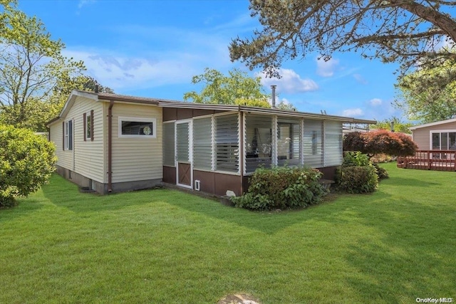 back of house with a yard