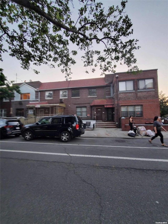 view of outdoor building at dusk