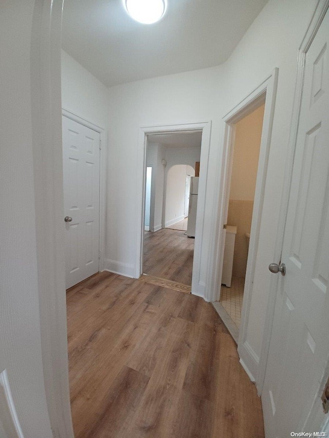 hall with light hardwood / wood-style floors