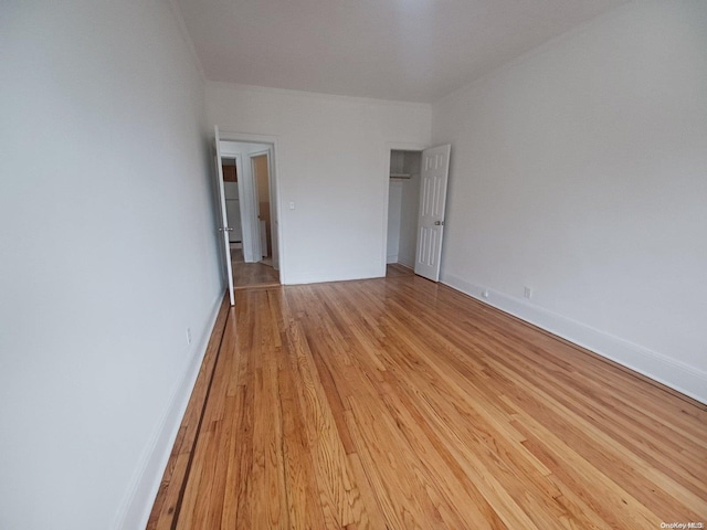 unfurnished bedroom with light wood-type flooring