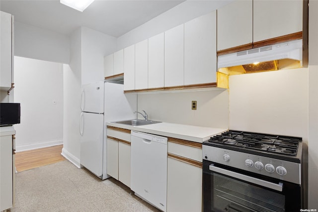 kitchen with white cabinets, white appliances, and sink