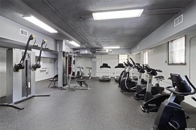 workout area featuring a textured ceiling