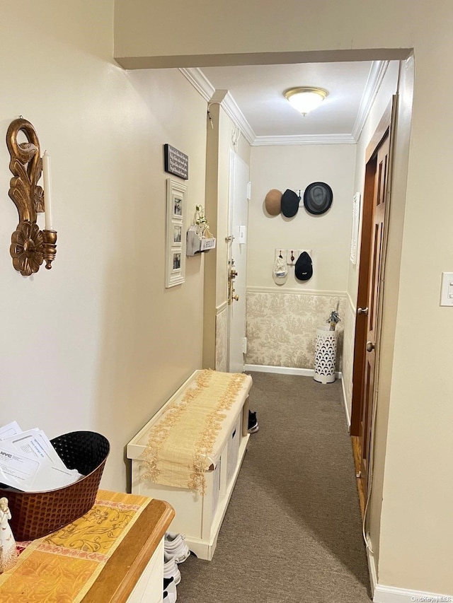 corridor with crown molding and dark carpet