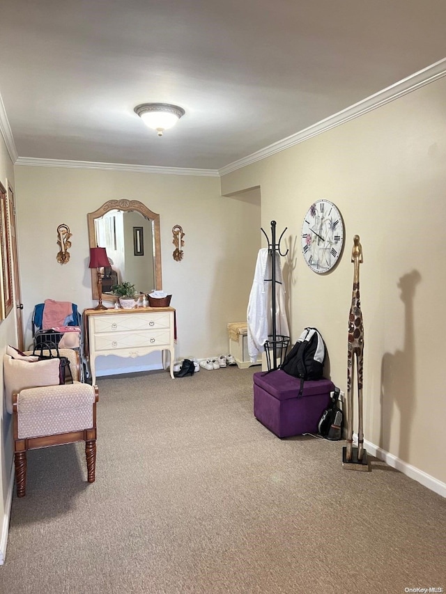 sitting room featuring carpet flooring and ornamental molding