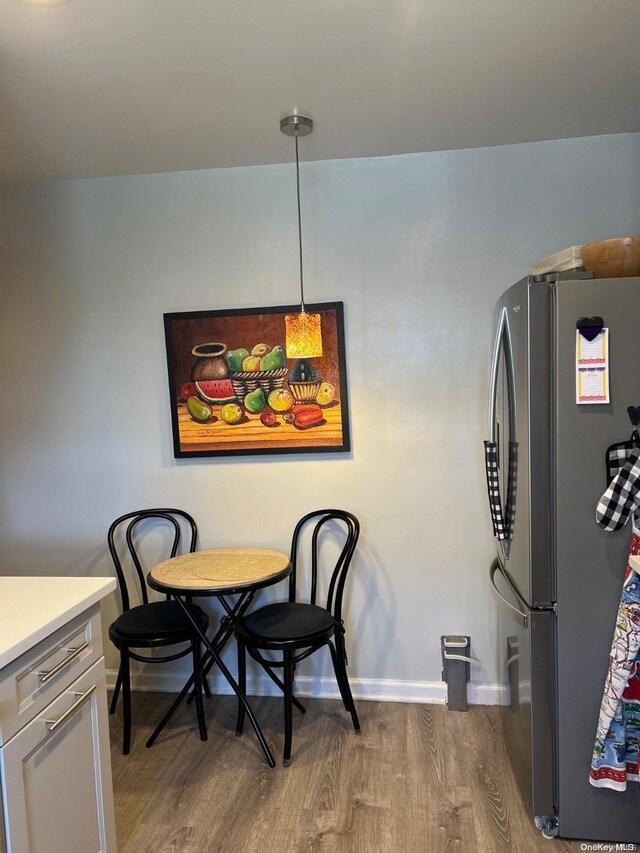 dining area featuring hardwood / wood-style flooring