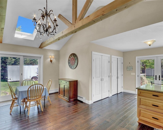 dining room featuring dark hardwood / wood-style flooring, a skylight, and a wealth of natural light