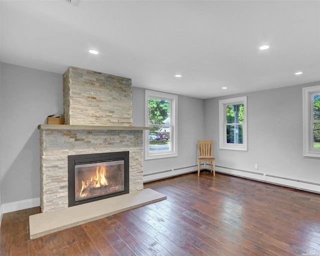 unfurnished living room featuring a fireplace and dark hardwood / wood-style floors