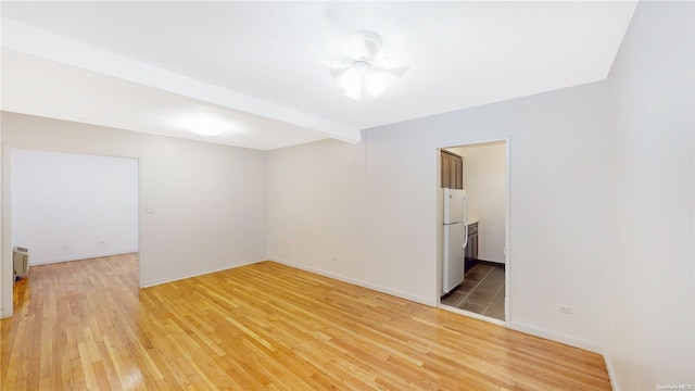 unfurnished room featuring wood-type flooring