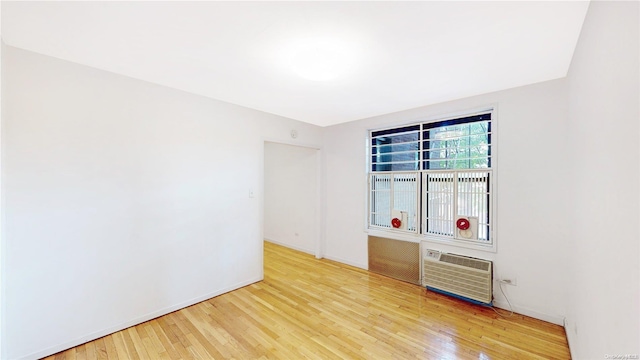 unfurnished room featuring wood-type flooring