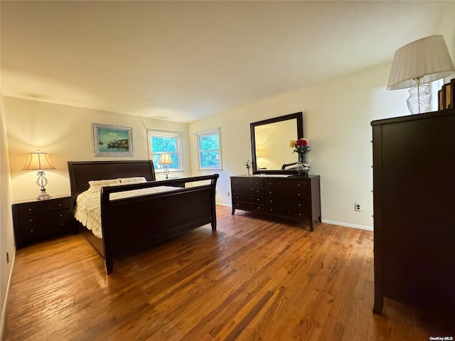 bedroom featuring hardwood / wood-style flooring