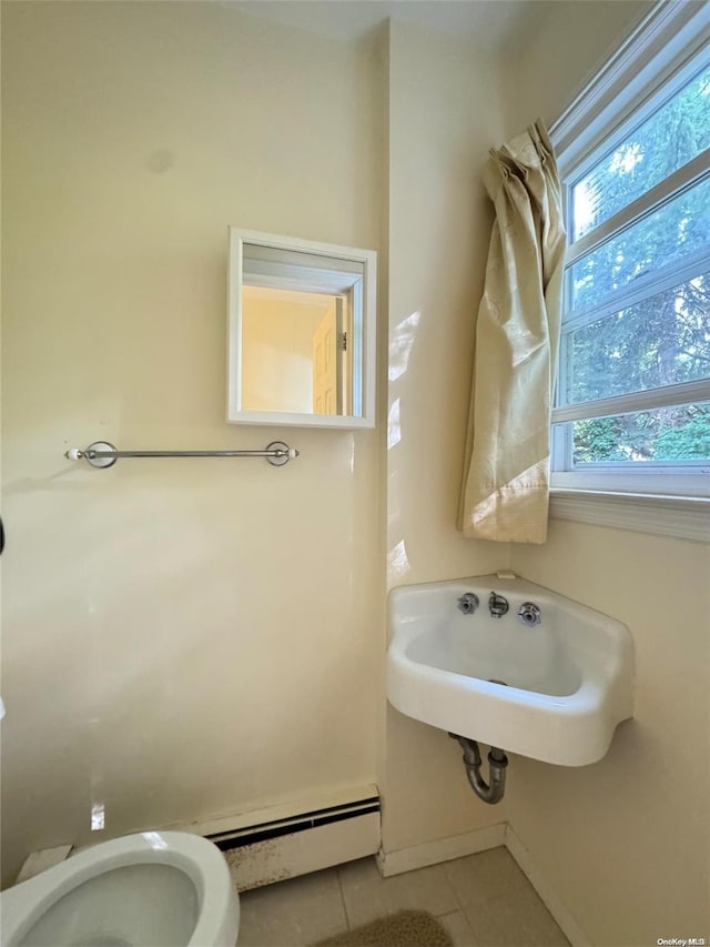 bathroom with tile patterned floors, sink, and toilet