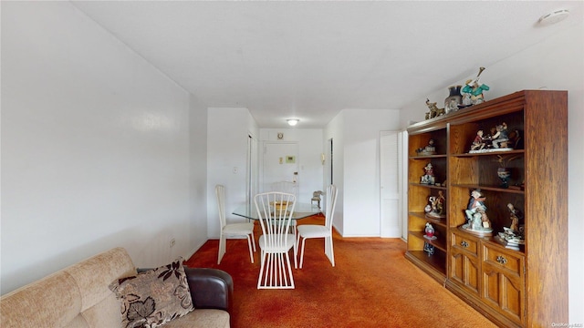 dining space with carpet flooring