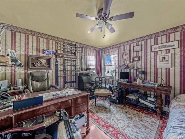 office area with light wood-type flooring and ceiling fan