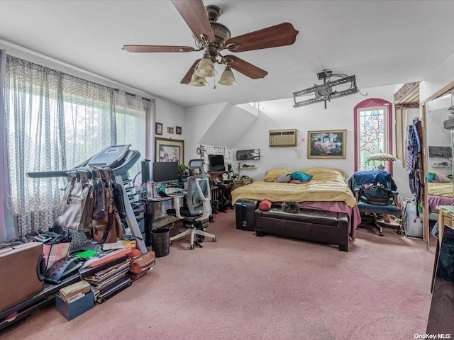 carpeted bedroom featuring ceiling fan, an AC wall unit, and multiple windows