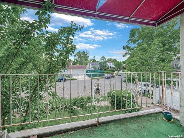 view of patio featuring a balcony