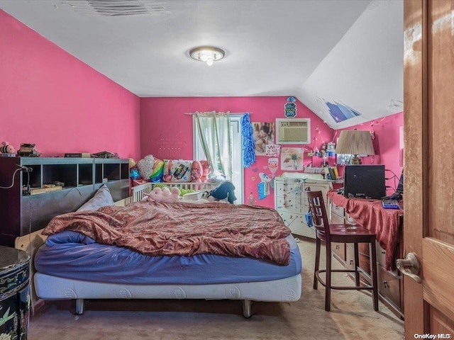 carpeted bedroom with a wall unit AC and vaulted ceiling