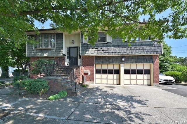 bi-level home featuring a garage