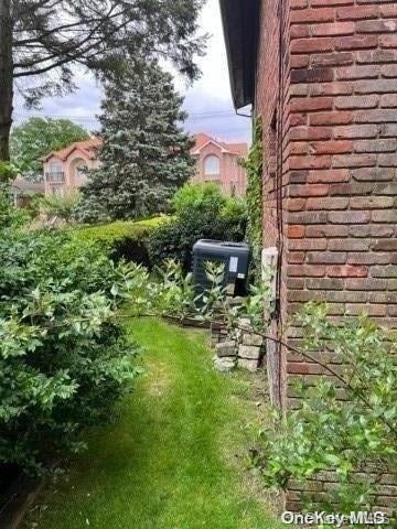 view of yard with central AC unit