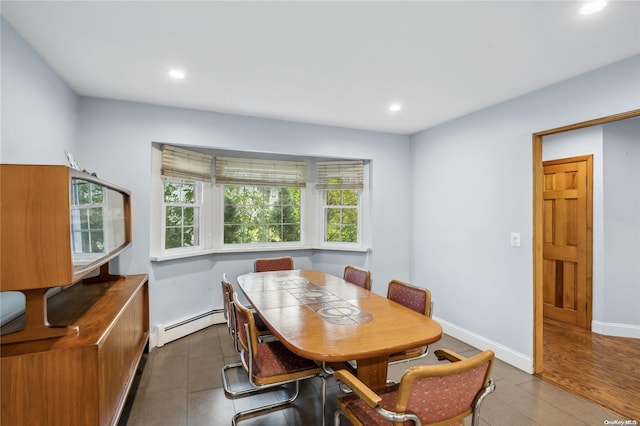 dining area with a baseboard heating unit