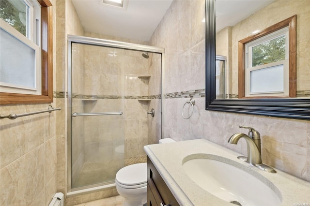 bathroom with toilet, a shower with door, and tile walls