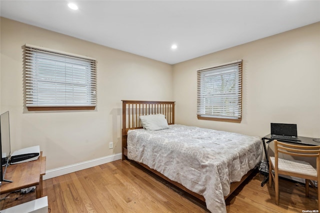 bedroom with light hardwood / wood-style flooring