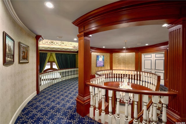 hall with ornamental molding and ornate columns