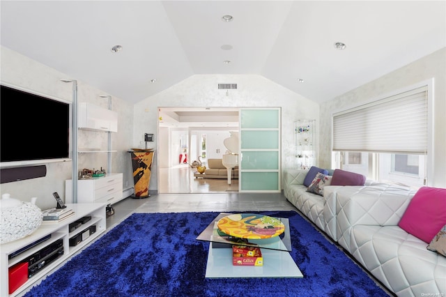 living room featuring tile patterned flooring and vaulted ceiling