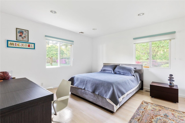 bedroom with light hardwood / wood-style flooring