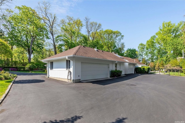 view of side of property with a garage