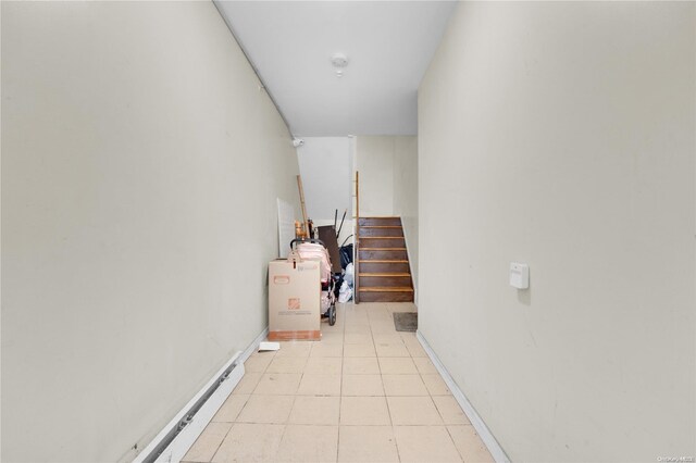 stairway featuring tile patterned floors