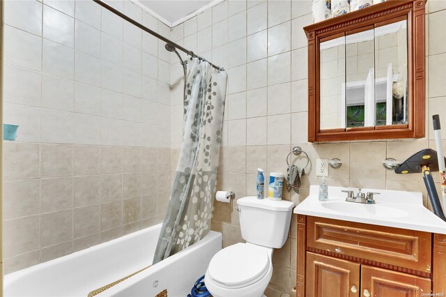 full bathroom featuring tasteful backsplash, shower / bath combo, tile walls, and toilet