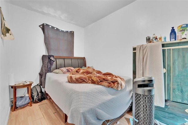 bedroom with wood-type flooring