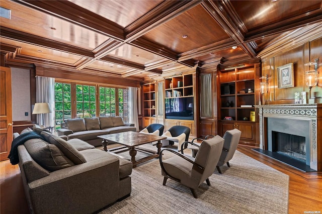 living room with wooden ceiling, coffered ceiling, crown molding, wooden walls, and light hardwood / wood-style floors