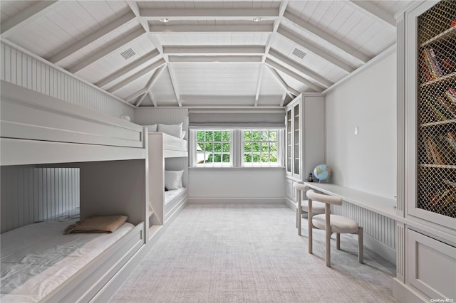 bedroom with light colored carpet and lofted ceiling with beams