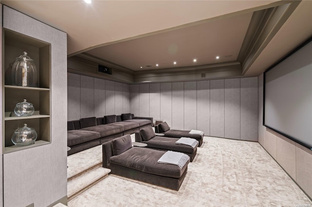 home theater room featuring light carpet and crown molding